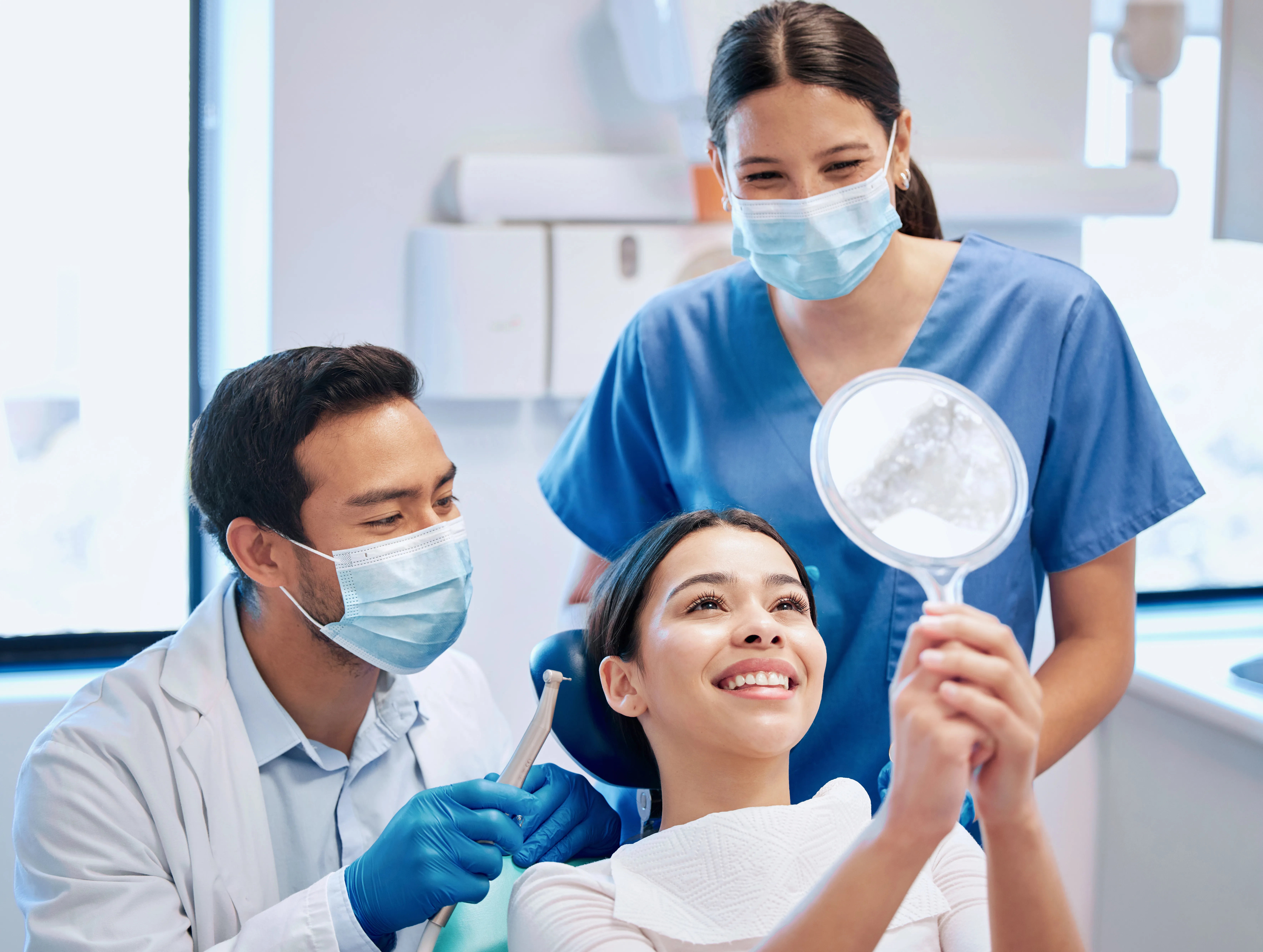 Dentist reviewing treatment options with a patient in a modern dental clinic